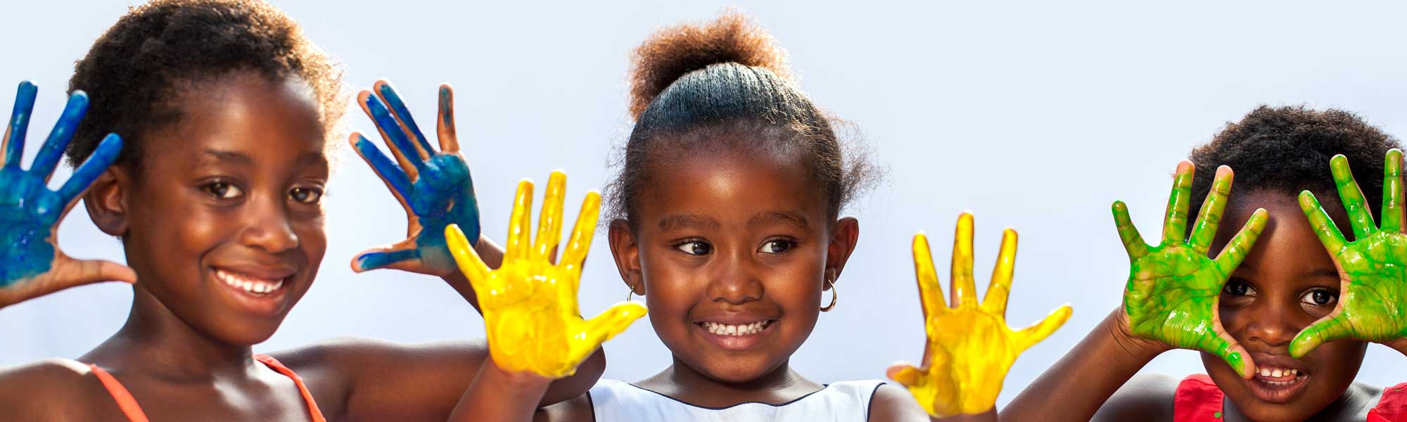 Image of three girls with painted hands depicting Signature of Hope's 'ever lasting change'